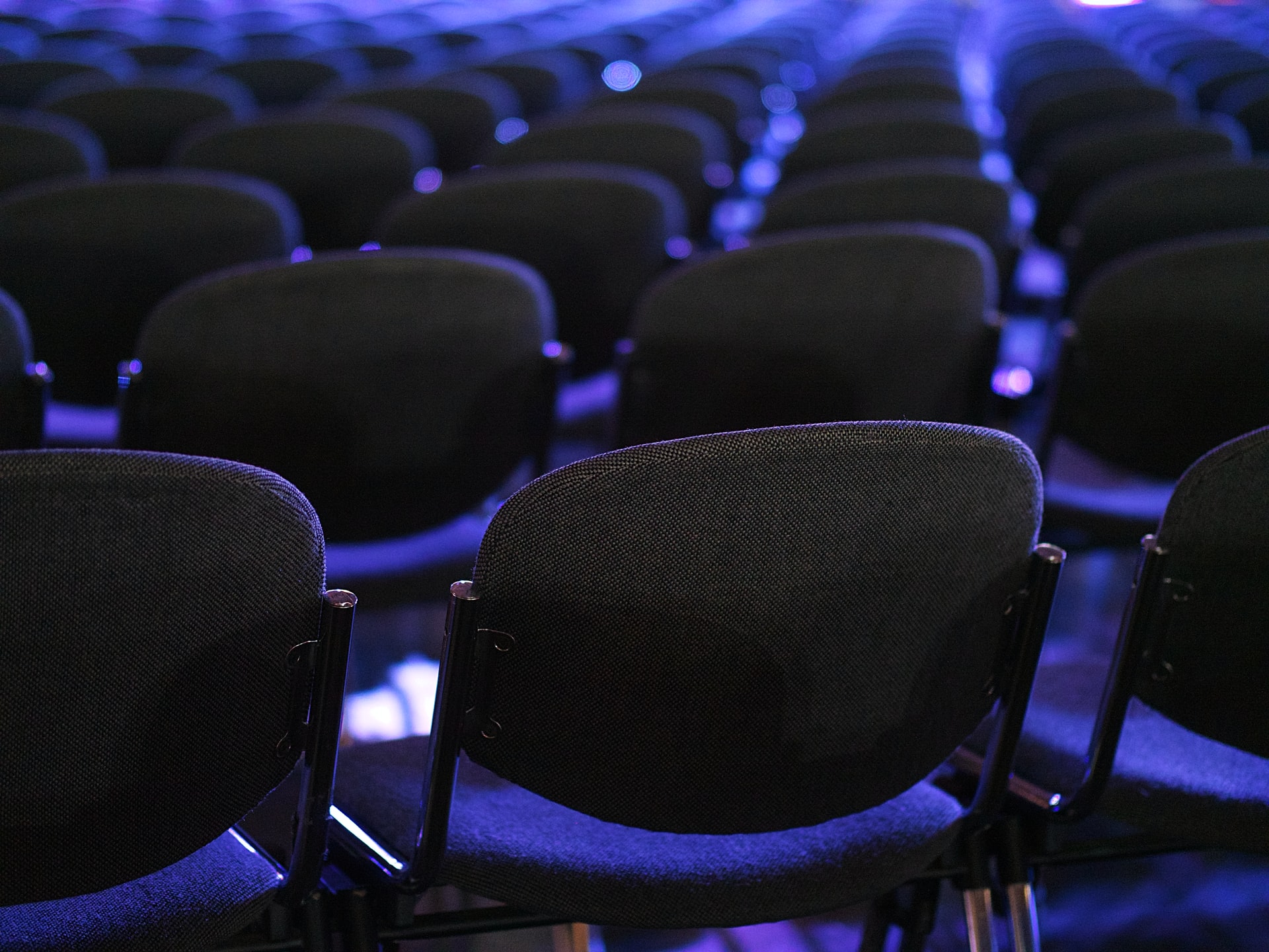 black chairs in purple lighting